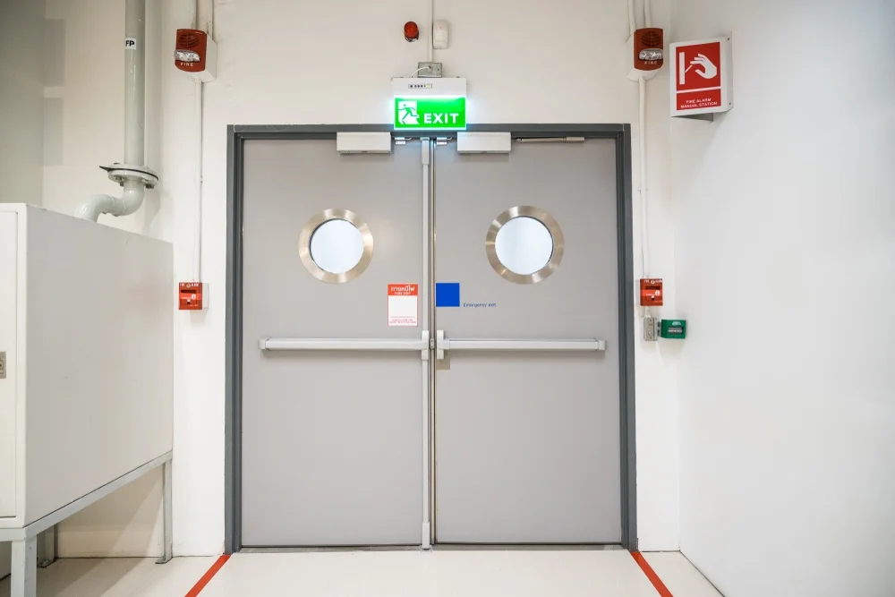 Electrical room door with panic bar