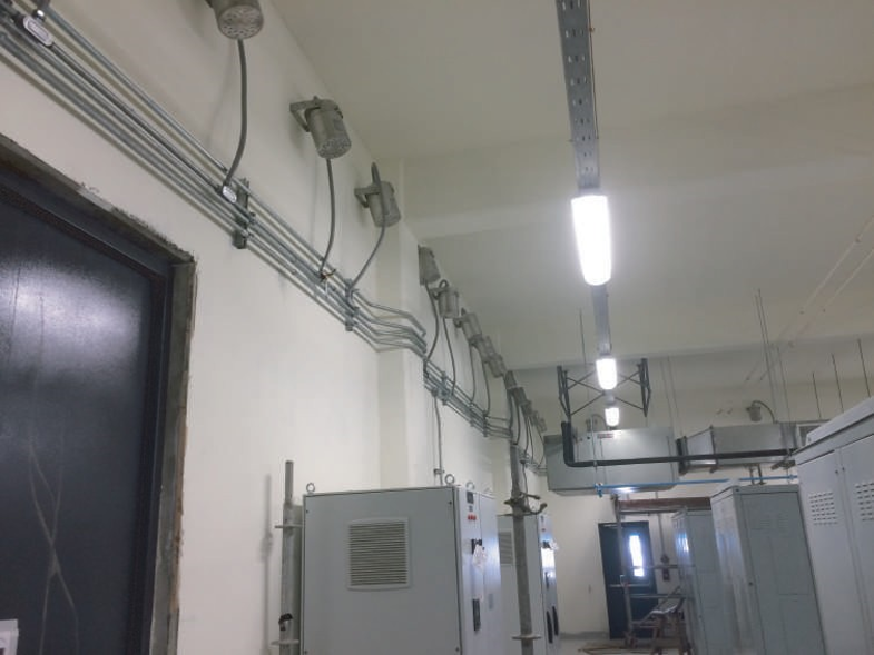 Ceiling lights over electrical gear