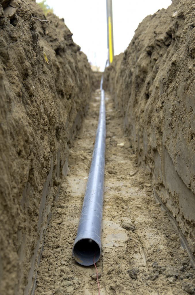 Trench with conduit at correct depth